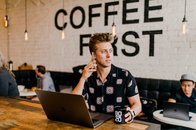 person doing business in a coffee shop