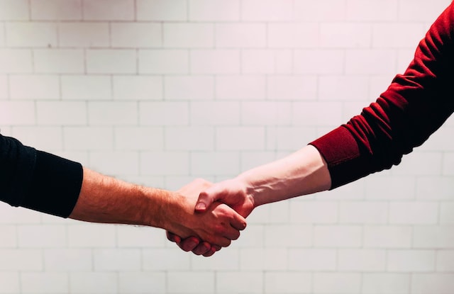 two person shaking hands