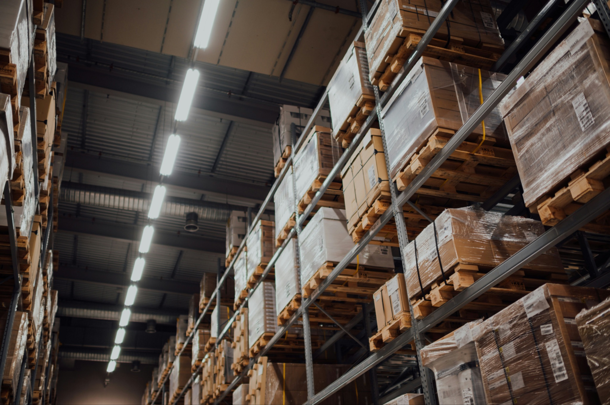 brown-cardboard-boxes-on-white-metal-rack